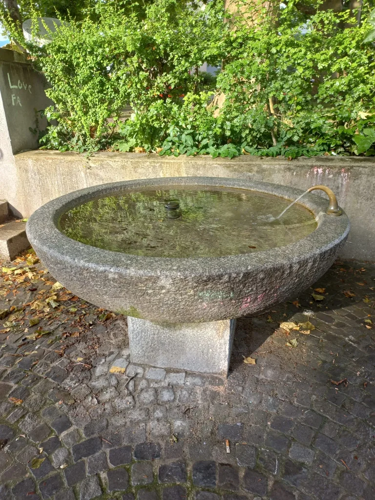 A glass being filled with clean drinking water from a tap