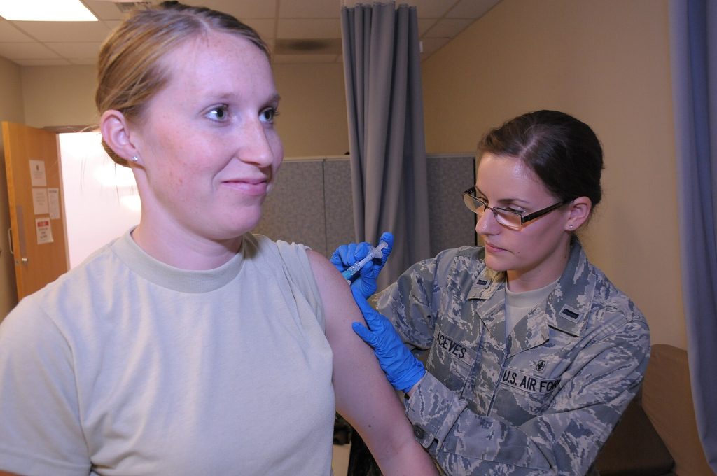 Measles Update: Cases Reach 4,410 Across the United States Healthcare worker preparing a measles MMR vaccine dose at a community clinic
